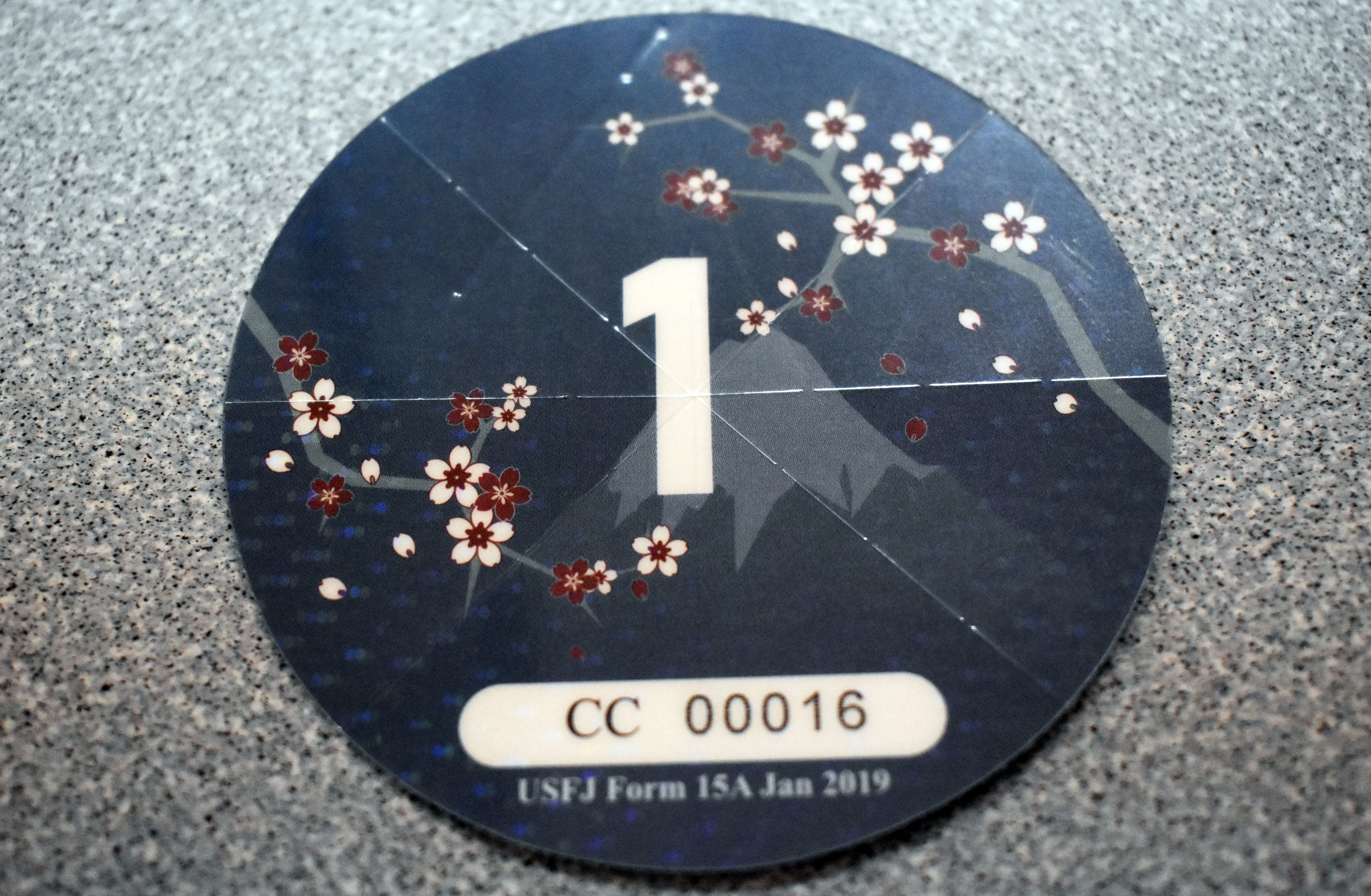 An expired USFJ windshield decal from 2019